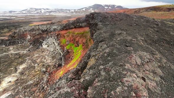 Eruption of Geyser in Iceland. Red Soil, Like the Surface of the Planet Mars
