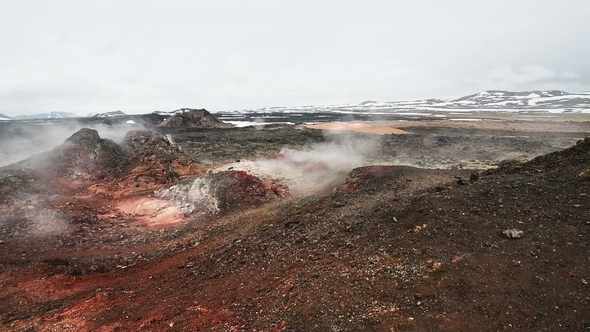Eruption of Geyser in Iceland. Red Soil, Like the Surface of the Planet Mars