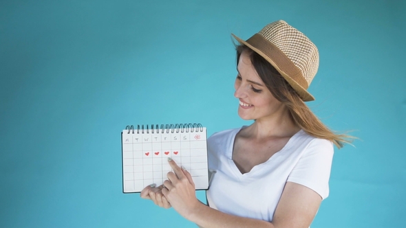 Girl Counts Days on Calendar Stock Footage VideoHive