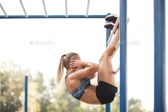 Woman performing raises - Stock Photo - Images