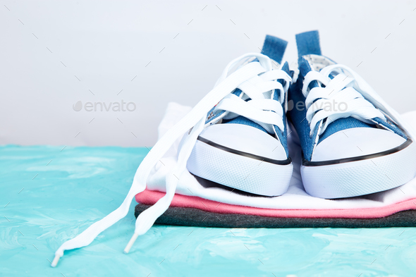 Female sneakers shoes and tee - Stock Photo - Images