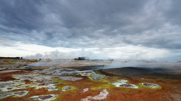 Eruption of Geyser in Iceland. Red Soil, Like the Surface of the Planet Mars alt