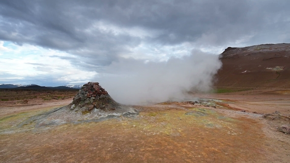 Eruption of Geyser in Iceland. Red Soil, Like the Surface of the Planet Mars