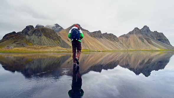 Amazing Mountains Reflected in the Water at Sunset. Stoksnes, Iceland alt