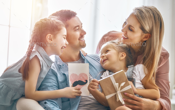 daughter congratulating dad - Stock Photo - Images