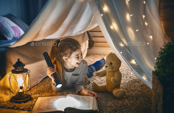 child is reading a book - Stock Photo - Images