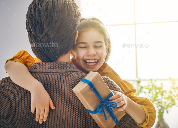 daughter congratulating dad - Stock Photo - Images