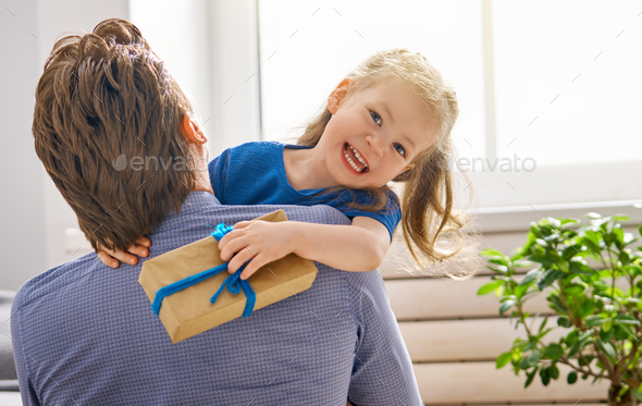 daughter congratulating dad - Stock Photo - Images