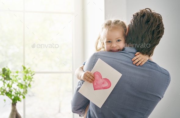 daughter congratulating dad - Stock Photo - Images