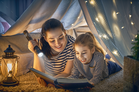 Mom and child reading a book - Stock Photo - Images