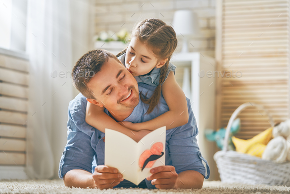 daughter congratulating dad - Stock Photo - Images