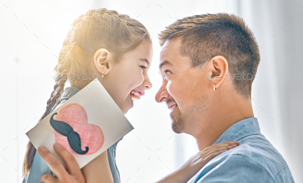 daughter congratulates dad - Stock Photo - Images