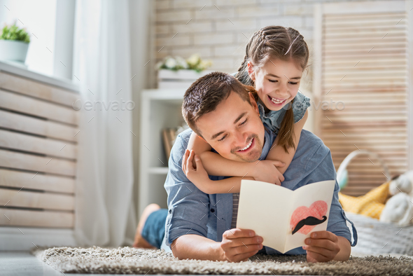 daughter congratulating dad - Stock Photo - Images