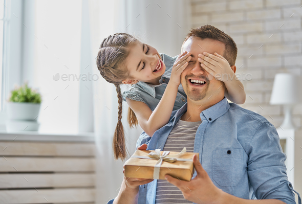 daughter congratulating dad - Stock Photo - Images