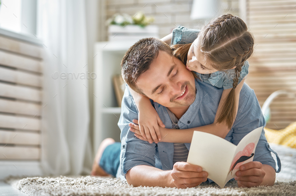 daughter congratulating dad - Stock Photo - Images