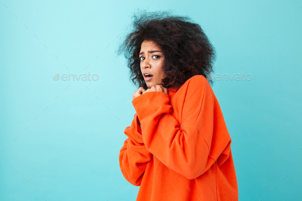 Colorful image closeup of scared woman in red shirt posing on ca - Stock Photo - Images