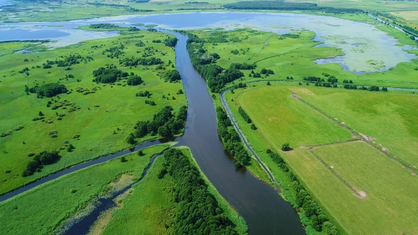 Flight Over River in Meadows