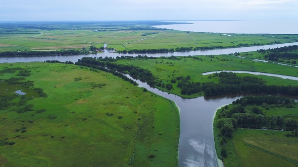 Flight Over River in Meadows