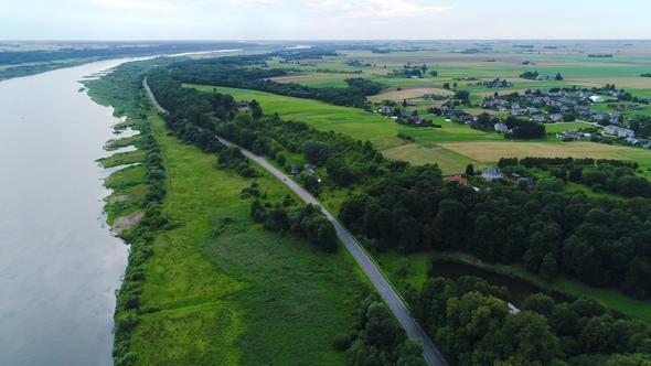 Flight Over River in Meadows