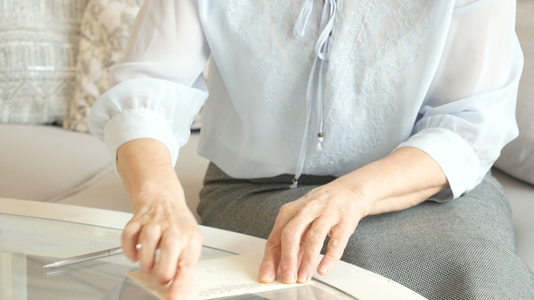 , Senior Woman's Hands Writing On a Piece of Paper, Elderly Woman Writing a Letter