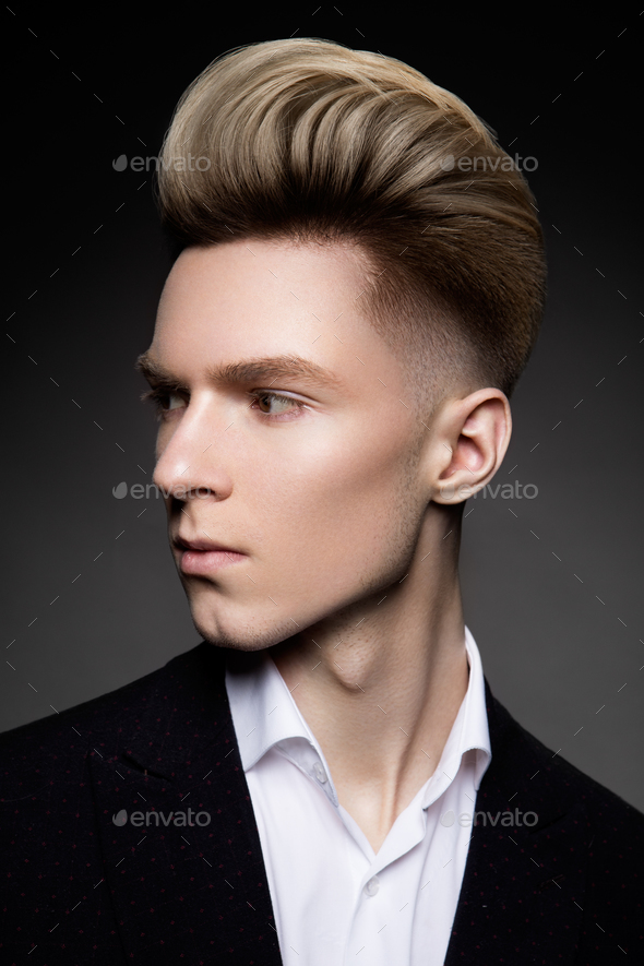 Side View Portrait Of Thinking Stylish Young Man Stock Photo By Korabkova