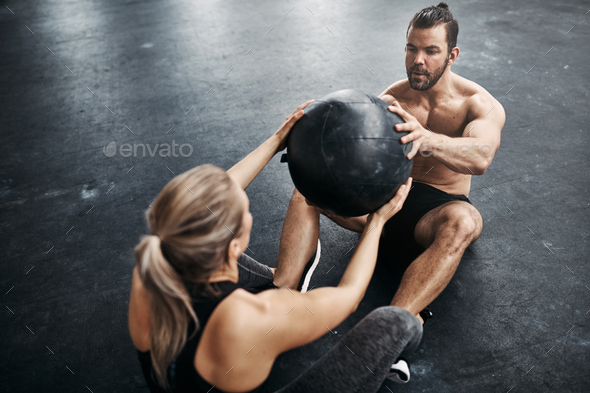 Fit people exercising with a medicine ball at the gym - Stock Photo - Images