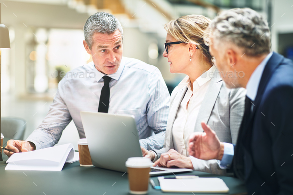 Mature corporate colleagues meeting together in a modern office - Stock Photo - Images