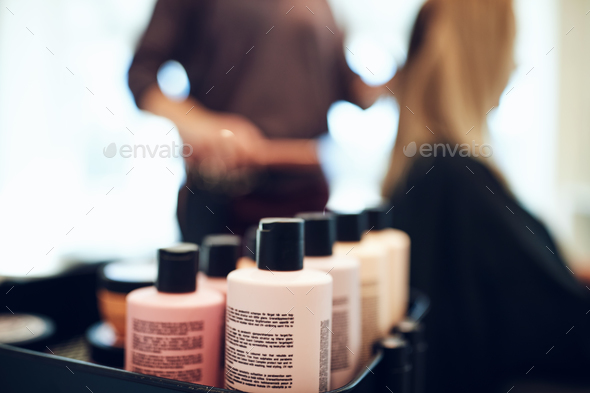 Bottles of styling products in a hair salon - Stock Photo - Images