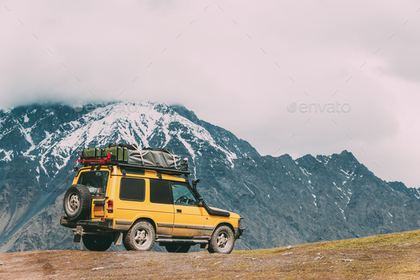 SUV Car On Off Road In Spring Mountains Landscape In Georgia. Dr - Stock Photo - Images