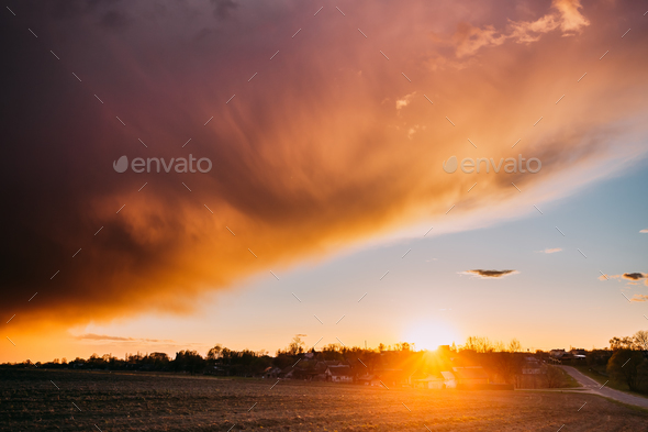 Spring Sunset Sunrise. Sun Above Village In Belarusian Countrysi - Stock Photo - Images