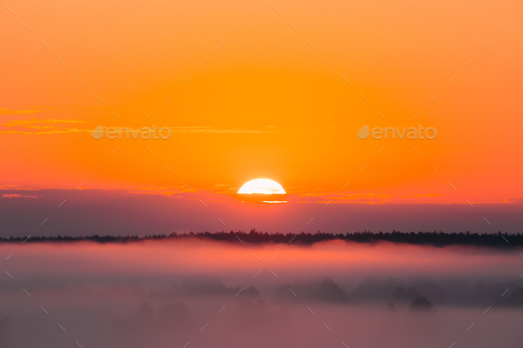 Amazing Sunrise Over Misty Landscape. Scenic View Of Foggy Morni - Stock Photo - Images