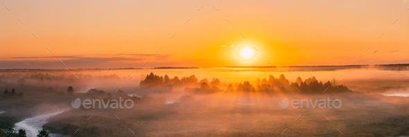 Amazing Sunrise Over Misty Landscape. Scenic View Of Foggy Morni - Stock Photo - Images