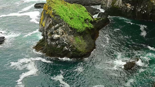 Noisy Water Under a Rock. Ocean in the Iceland