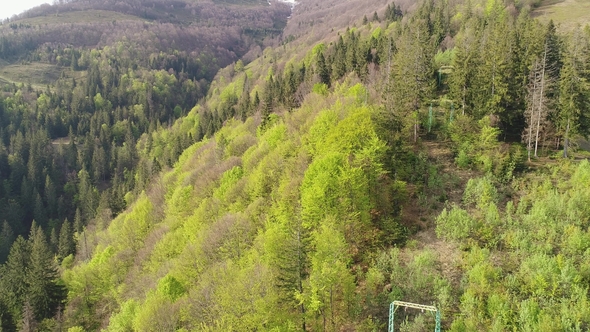 Flight Over the Forest with Lifts in the Mountains View of Ukrainian Carpathians