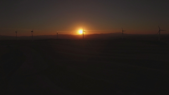 Aerial View of Wind Turbines at Sunset