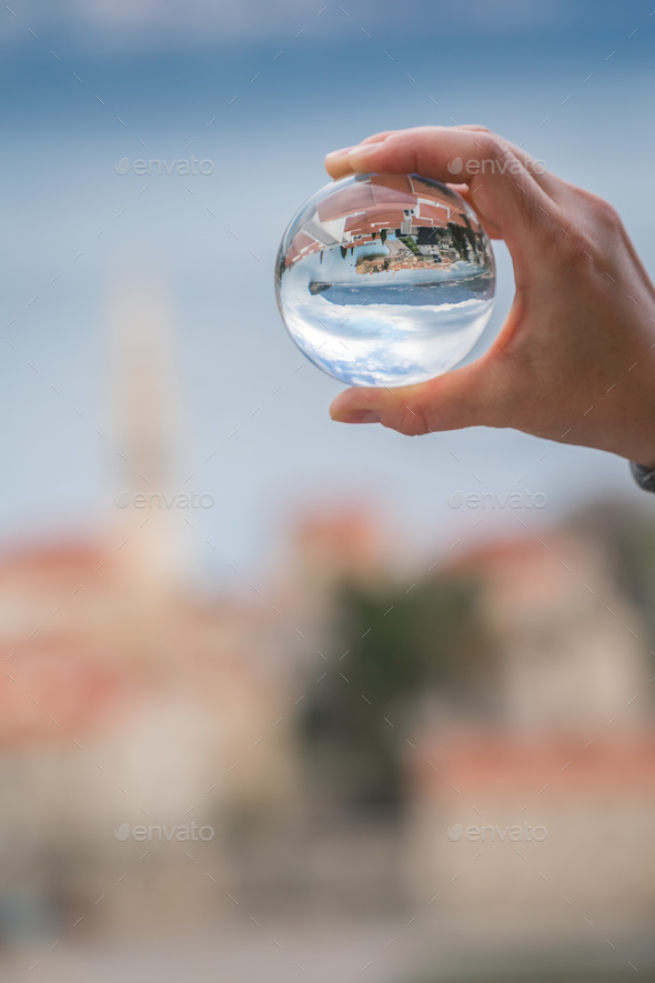 Budva reflected in a glass ball - Stock Photo - Images