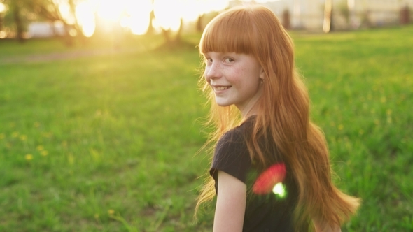 Little Beautiful Redhead Girl Goes To Meet Sun and Looks Into Camera