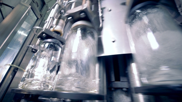 Bottles Filling with Alcohol, Bottom View alt