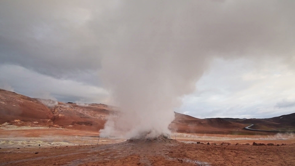 Eruption of Geyser in Iceland. Red Soil, Like the Surface of the Planet Mars