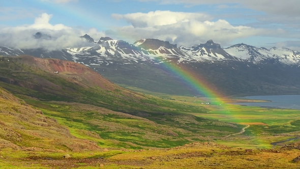 Fantastic View of Rainbow over a Glacier in Iceland Mountains