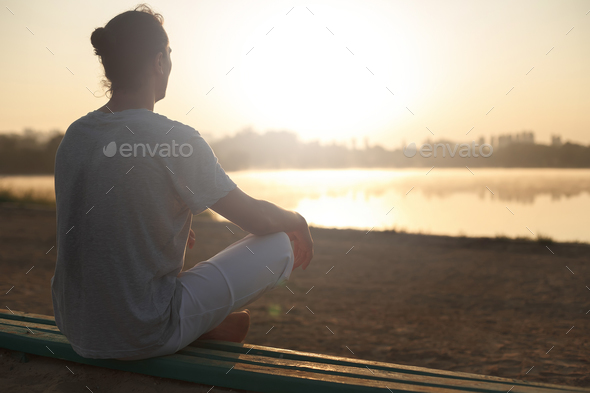 Shot of healthy young man taking a break after morning workout. - Stock Photo - Images