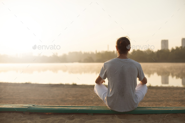 Shot of healthy young man taking a break after morning workout. - Stock Photo - Images