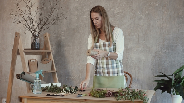 Beautiful Florist Creating Bouquet of Flowers alt