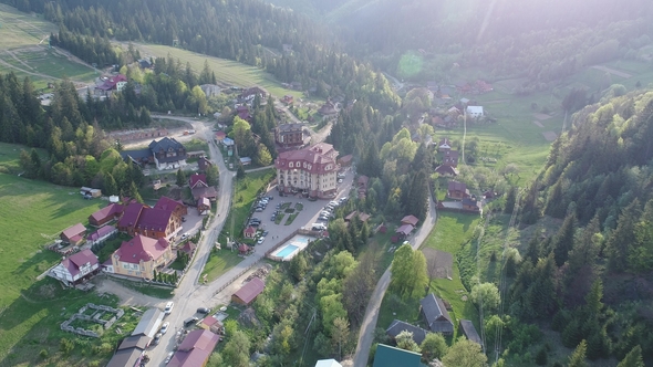 Flight Over the Village in the Ukrainian Carpathians Mountains. Grand Hotel Pylypets Aerial View
