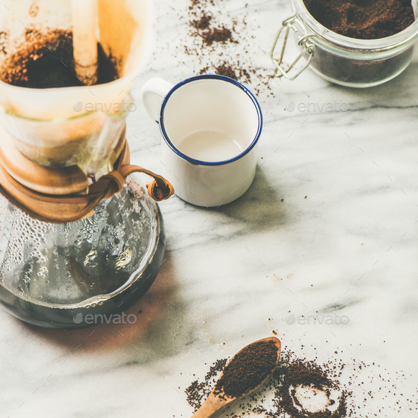 Black filtered coffee in flask and white cup, square crop - Stock Photo - Images