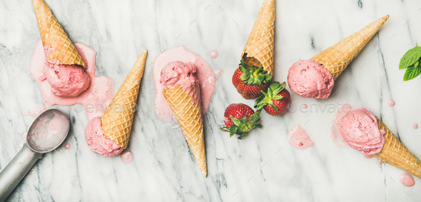 Flat-lay of homemade yogurt strawberry ice cream over marble background - Stock Photo - Images