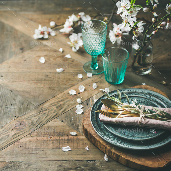 Spring Easter Table setting over vintage wooden background, square crop - Stock Photo - Images