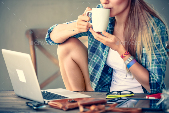 Student girl drinking coffee - Stock Photo - Images