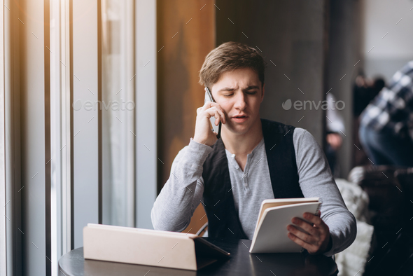 Young man with tablet pc computer at cafe - Stock Photo - Images