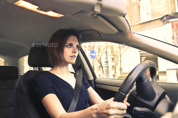 Woman driving a car - Stock Photo - Images
